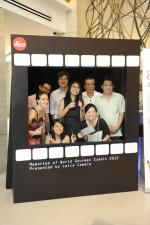 <br />Guests taking a picture at the Leica photobooth