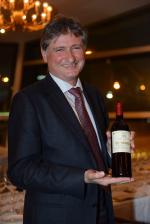 <br />Paolo de Marchi presenting a bottle of Isole e Olena wine