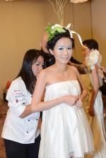 <br />Chef Janice Wong giving some final touches for the chocolate dresses