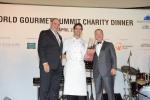 <br />Mr Peter Knipp and Dr Henry Tay presented a token of appreciation to Chef Damien le Bihan